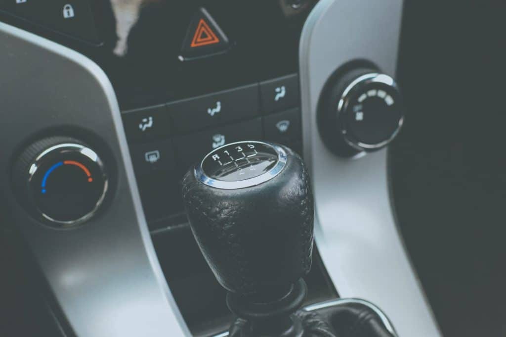 A close up of a gear shift in a car.
